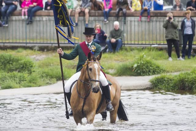 Action and revellers on Common Riding Friday in Hawick.