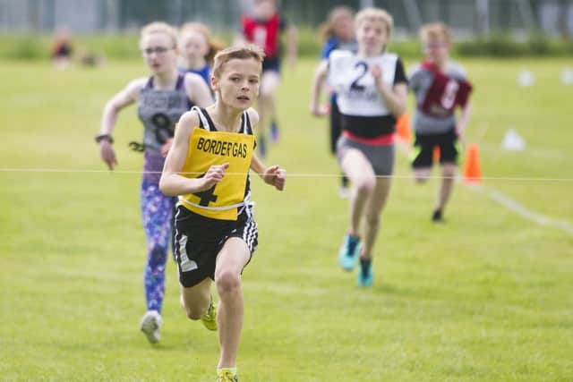 Connor McLeod from Hawick RP wins heat 2 of the 200m Handicap (picture: Bill McBurnie)