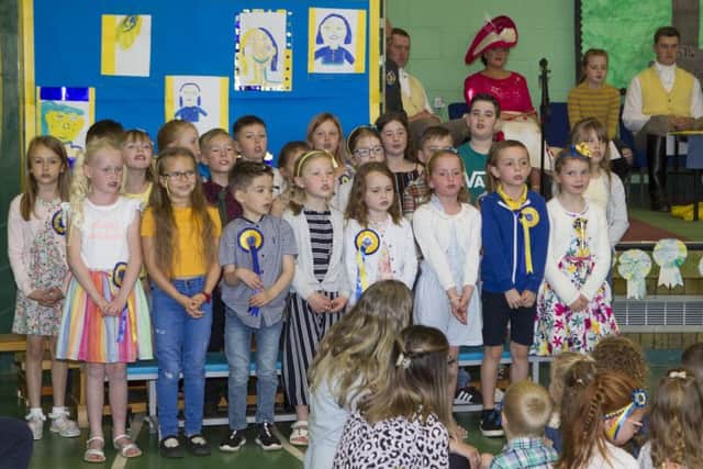 Stirches pupils welcome the principals.
