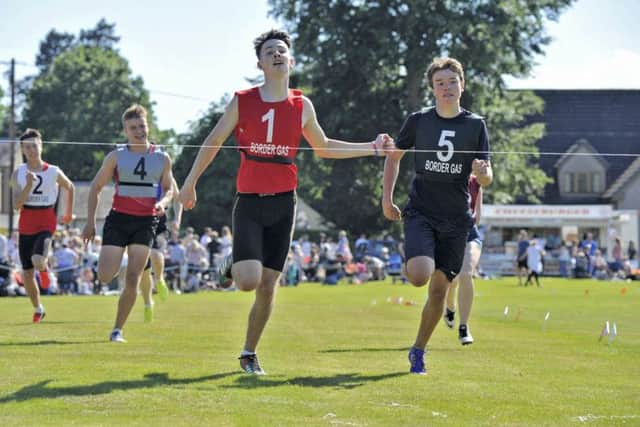 Selkirk games. Douglas Young of Kelso in bib number one wins the 200mtrs Youth Group 'A' final.