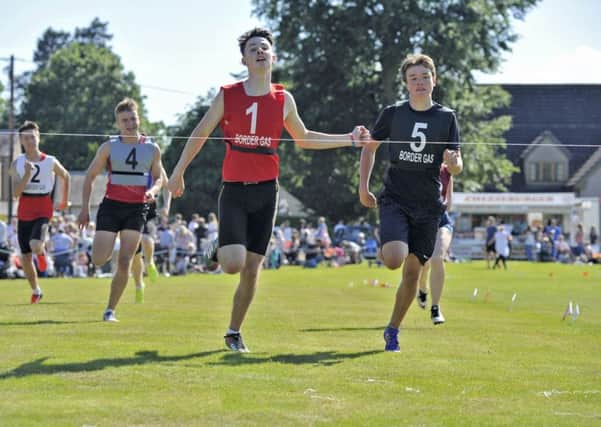 Selkirk games. Douglas Young of Kelso in bib number one wins the 200mtrs Youth Group 'A' final.