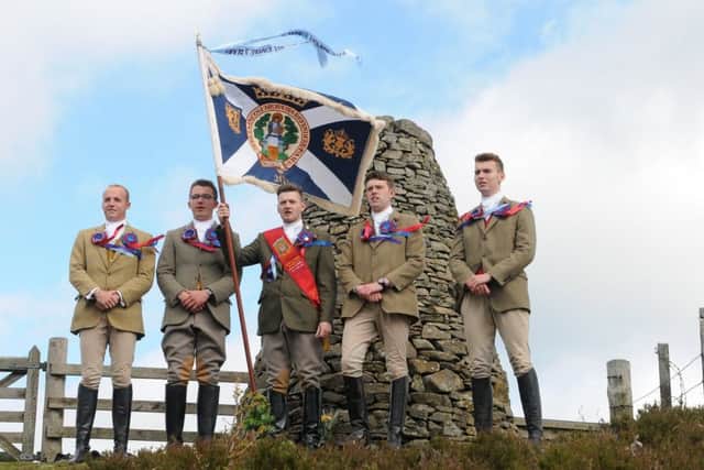 The Standard Bearer and his attendants sing Hail Smilin' Morn at the Three Brethren.
