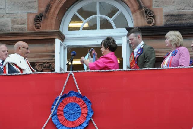 The Hon Provost's wife Elspeth busses the Burgh flag.