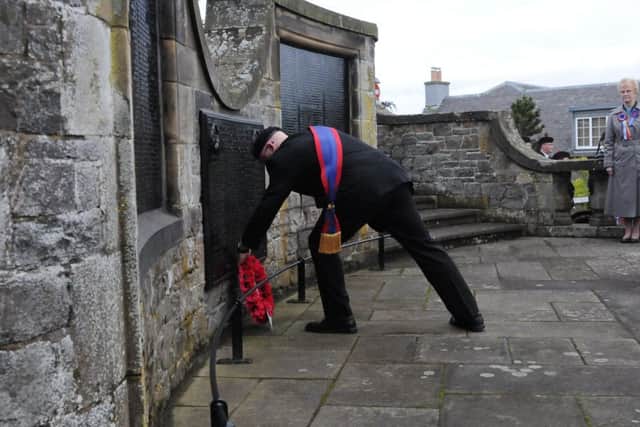 Justin Gilchrist lays a wreath on behalf of the Ex-Soldiers at their Act of Remembrance.