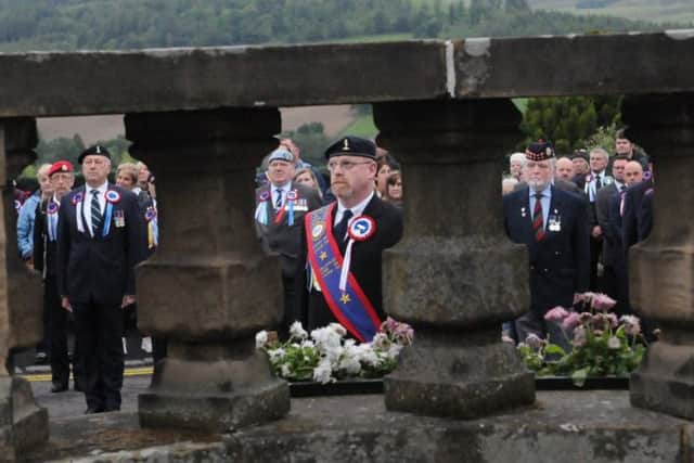 Ex-Soldiers Standard Bearer Justin Gilchrist at the war memorial.