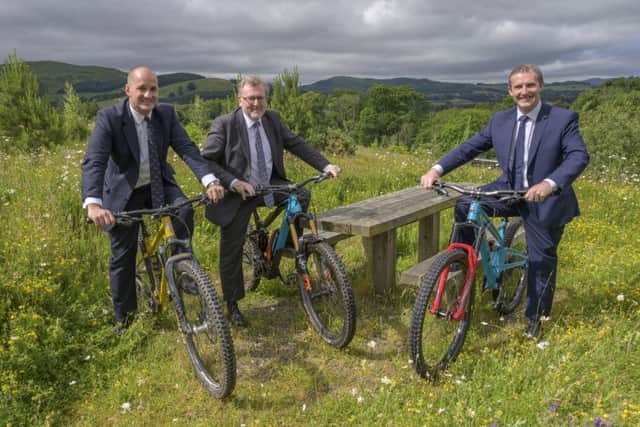 From left, UK Government ministers Jake Berry and David Mundell with Holyrood's Michael Matheson at Glentress today to sign off the Borderlands growth deal.