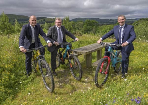 From left, UK Government ministers Jake Berry and David Mundell with Holyrood's Michael Matheson at Glentress today to sign off the Borderlands growth deal.