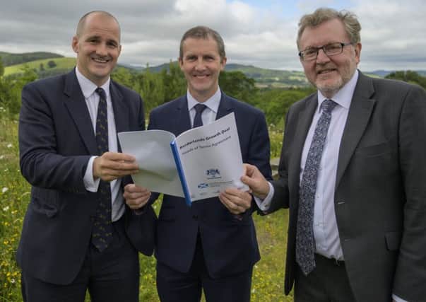 Scottish Government transport, infrastructure and connectivity secretary Michael Matheson, centre, with UK Government ministers Jake Berry, left, and David Mundell at Glentress on Monday to sign off the deal.