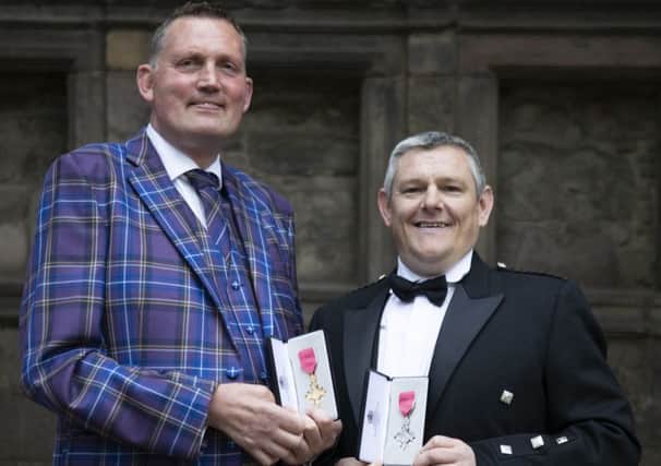 Rugby legend Doddie Weir and charity campaigner John Davidson with their honours yesterday. (Photo by Jane Barlow - WPA Pool/Getty Images)