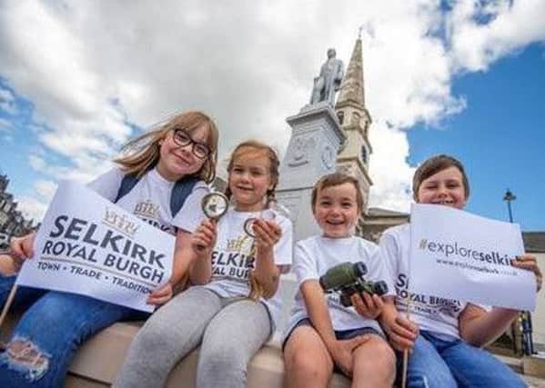 Poppy, Harry and Innes Davidson, and Bodie Herning launch the Explore Selkirk initiative.