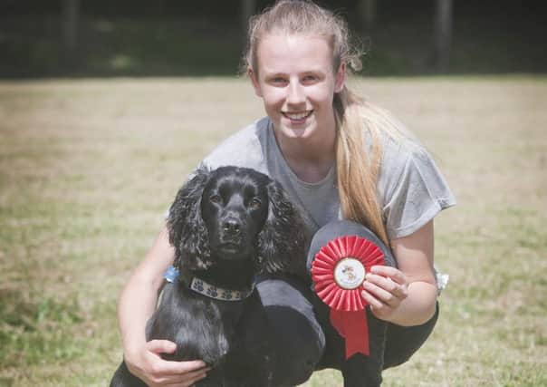 Proud owner Melissa Whittet at last year's show with the winner of the prize for most handsome dog winner, Ben the cocker spaniel.