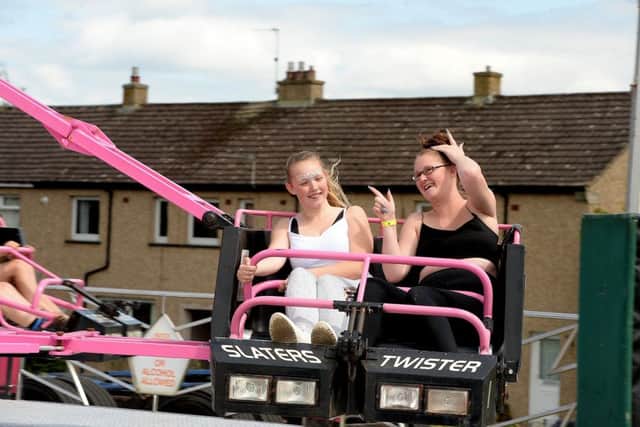 Enjoying a ride at Burnfoot Carnival are Chantella Frew and Jasmine Grieve.