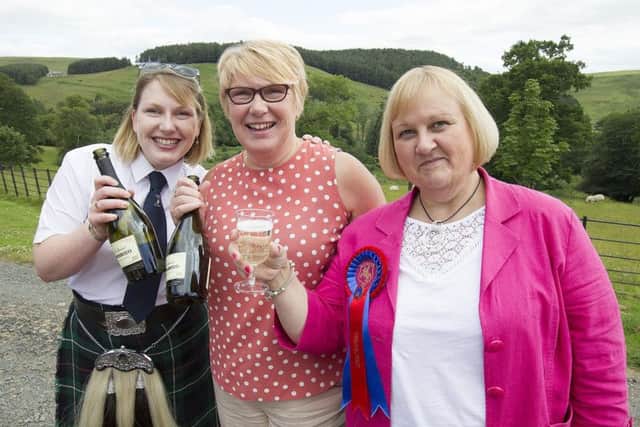 Kathryn and Christine Wylie with festival treasurer Helen Moffat.
