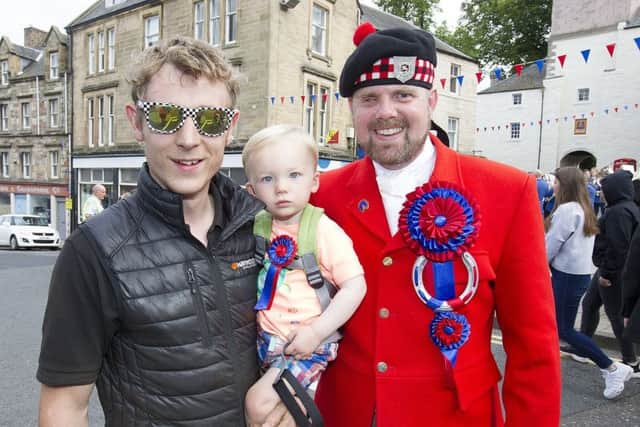 Greg Blair and son Ruaridh with herald Rob Reid