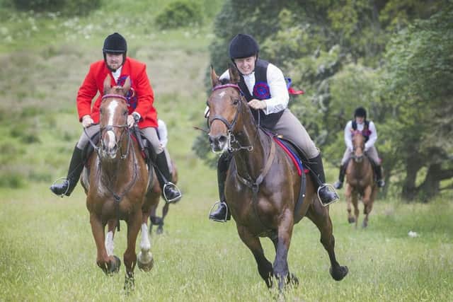 Herald Rob Reid and Callant Euan Munro lead the cavalcade to Redesire.