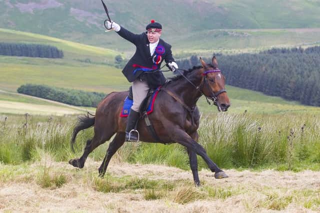 Callant Euan Munro gives the battle cry Jethart's Here as he gallops up Carter Bar.