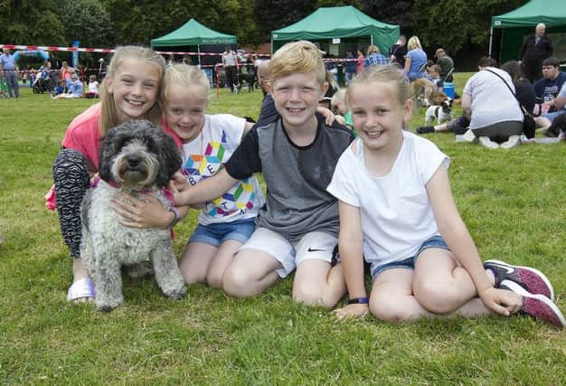 Marley and Rylee Domingo, with Braedyn and Hudson McLeod and Pixie the dog at Bark in the Park.
