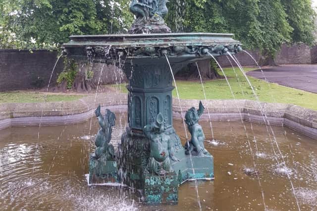 The fountain in the grounds of Selkirk's Victoria Halls, with water pouring from the left of the large middle bowl.