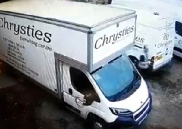 A man filmed on Chrysties Furnishing Centre's CCTV system apparently trying to open van doors.