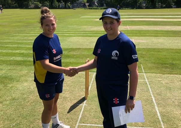 Gala and Scotland U17 Girls captain Charis Scott, right, shakes hands with opposing Durham captain Layla Tipton at the start of Monday's match at Meigle Park.
