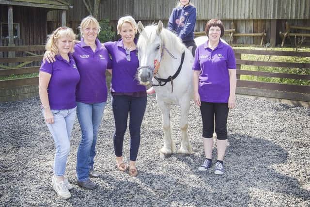 Alison Rowan, Lesley Hogg, Helen Hermiston, with Tyler Dodds on the horse and Stable Life CEO Mags Powell celebrating after receiving £15,000 from the localities bid fund towards a new indoor arena, just outside Selkirk at Dryden Farm.