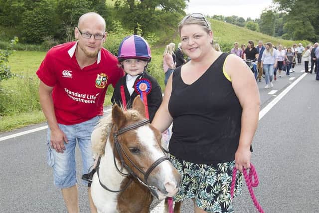 Michael, Lily-Mai and Joyce Weekley on festival day.