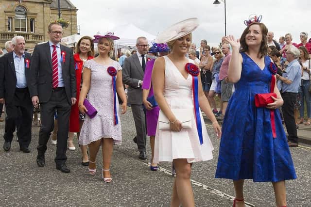 Lasses Dani Kirkman and Chloe Wight follow on foot to the war memorial.