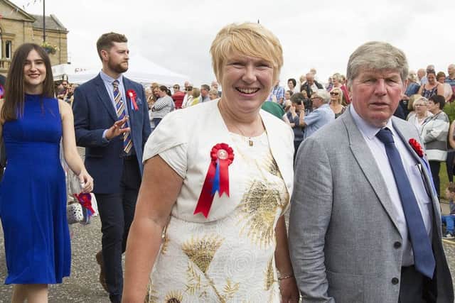 Christine and Graham Wylie follow in the patrons parade.