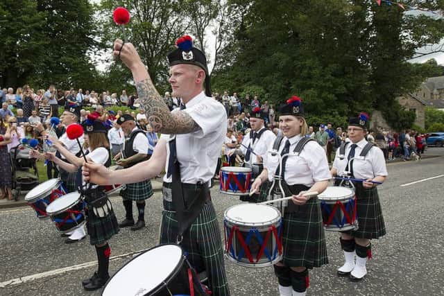 Jedburgh RBLS Pipe Band leads the procession away from the war memorial.