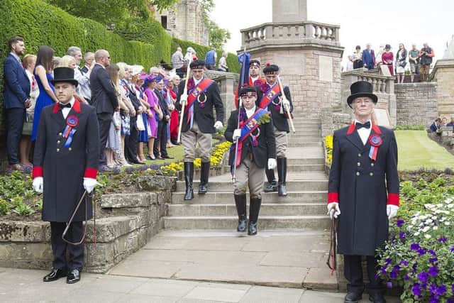 Jethart Callant Euan Munro completes the act of remembrance at Jedburgh war memorial.