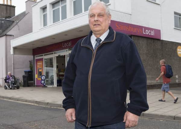 Selkirkshire councillor Gordon Edgar outside the Sainsbury's Local store in High Street.