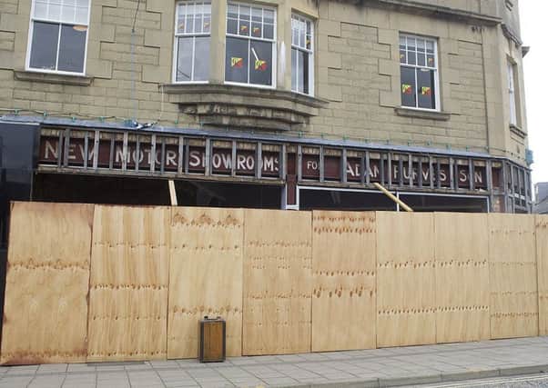 The old Adam Purves sign revealed by building work on the new Greggs in Galashiels.