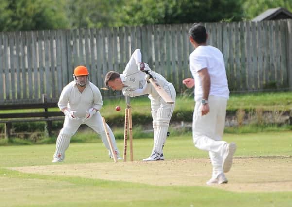 Rocking and rolling stumps as Ian Gardner of Selkirk is bowled (picture by Grant Kinghorn).