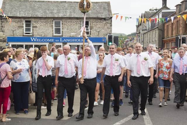 David Pool takes his turn with the herring as they parade at Langholm.