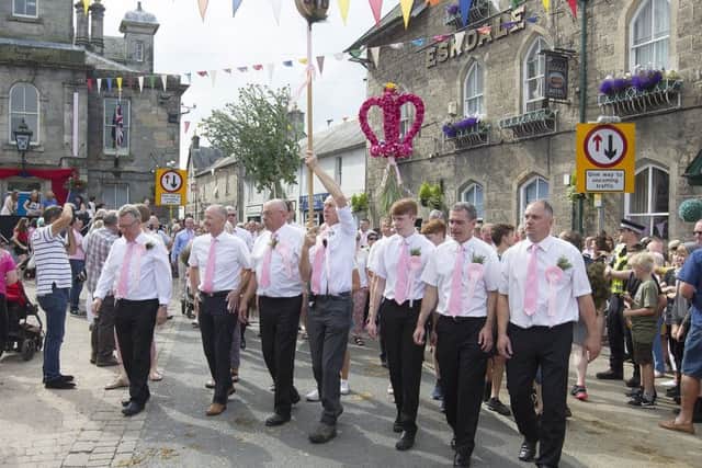Roger Maxwell, chiarman of the common riding carries the herring.