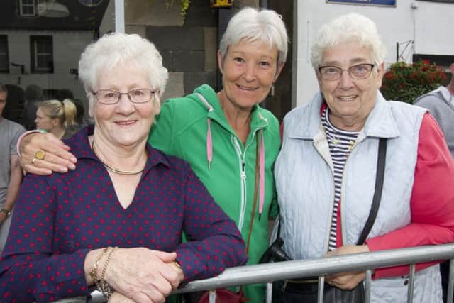 Kristine Elrick, Sandra Shackleton and Margaret Scott watch the parade.