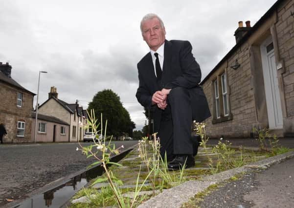 Hawick councillor Davie Paterson by the B6357 in Newcastleton.