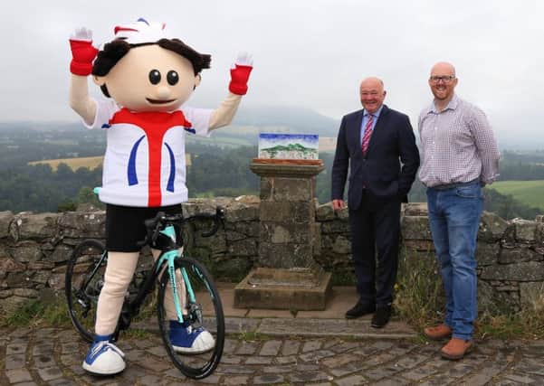 ToBi the Tour mascot with Councillor Mark Rowley and, right, trophy designer Kenny Scott.