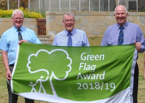 Councillors, from left, Stuart Marshall, George Turnbull and Watson McAteer celebrating Wilton Lodge Park claiming green flag status for the first time in July last year.
