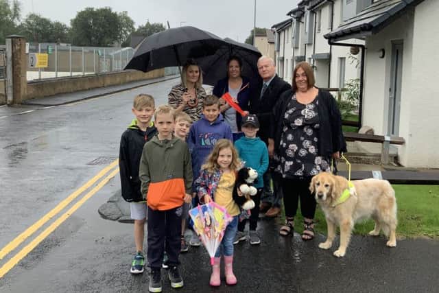 Residents of Liddesdale Road and Stonefield Place in Hawick handing over a petition to councillor Davie Paterson protesting about suggestions that double yellow lines there be removed.