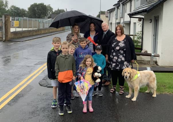 Residents of Liddesdale Road and Stonefield Place in Hawick handing over a petition to councillor Davie Paterson protesting about suggestions that double yellow lines there be removed.