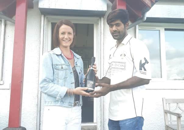 Gala CC's Sid Siddhu is presented with his man of the match award by Debbie Paterson, of main club sponsor Sinclair Duncan, on Gala Cricket Club's Supporters Day.