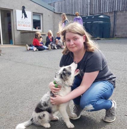 Megan Curran from Hawick, with Gus the marl collie, who won the prize for most handsome dog.