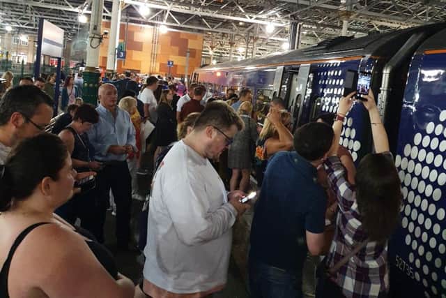 Passengers wait for the 21.56 train to leave Edinburgh's Waverley station. (Pic: Ross Ryrie)