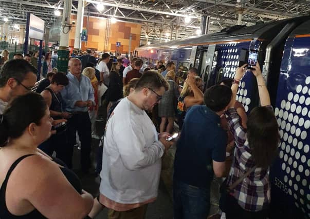 Passengers wait for the 21.56 train to leave Edinburgh's Waverley station. (Pic: Ross Ryrie)