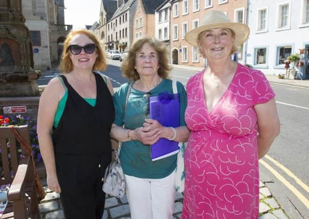 Gina Braydon, Jane Neagle and Georgiana Craster with a petition to keep the Jedburgh library where it is.