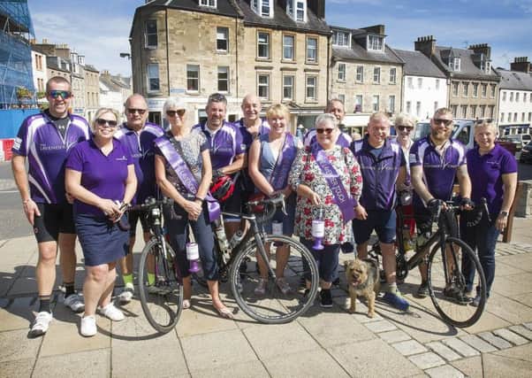 Charity trustees and volunteers welcome the team to Jedburgh on Saturday.