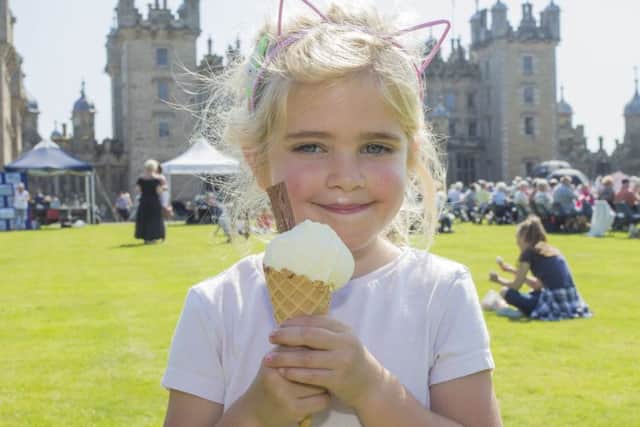 Thousands enjoy the massed pipe bands and dancing displays at Floors Castle.