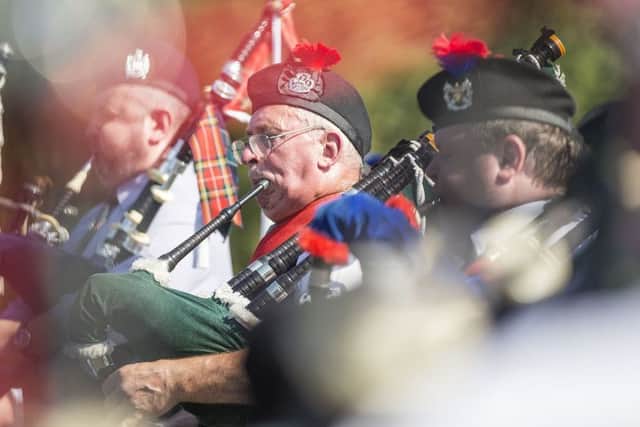 Thousands enjoy the massed pipe bands and dancing displays at Floors Castle.