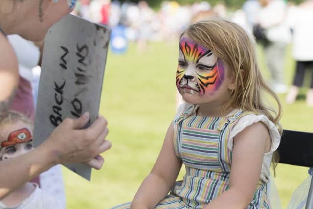 Thousands enjoy the massed pipe bands and dancing displays at Floors Castle.
